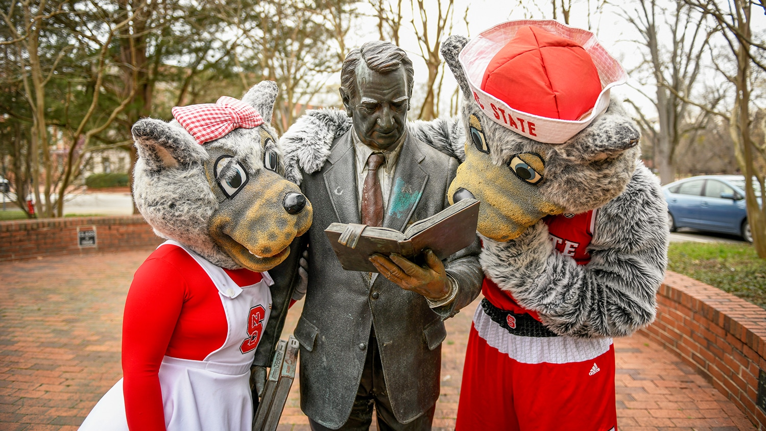 Mr. and Ms. Wuf with the Strolling Professor statue