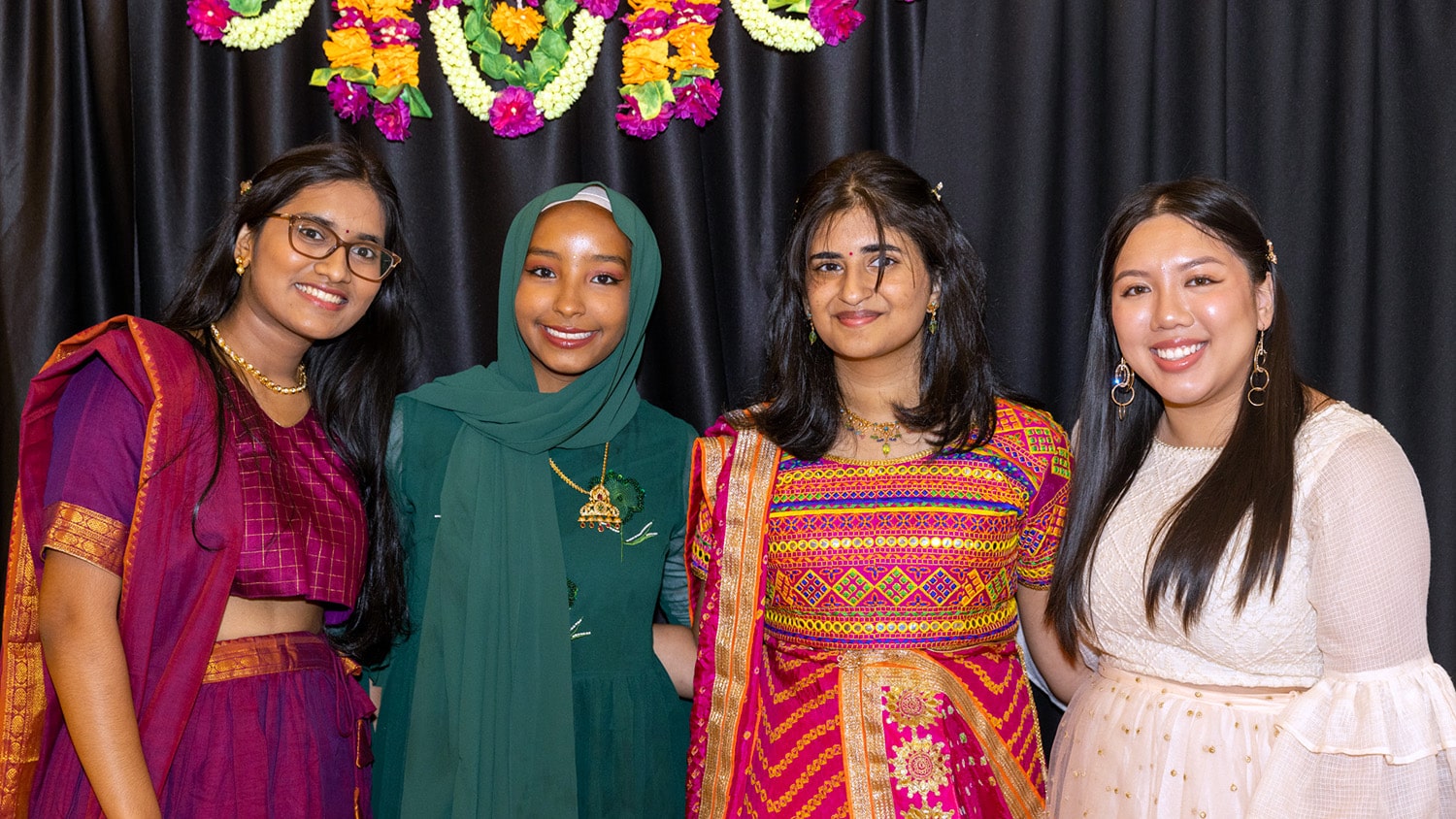 Four NC State students pose at an EKTAA event.